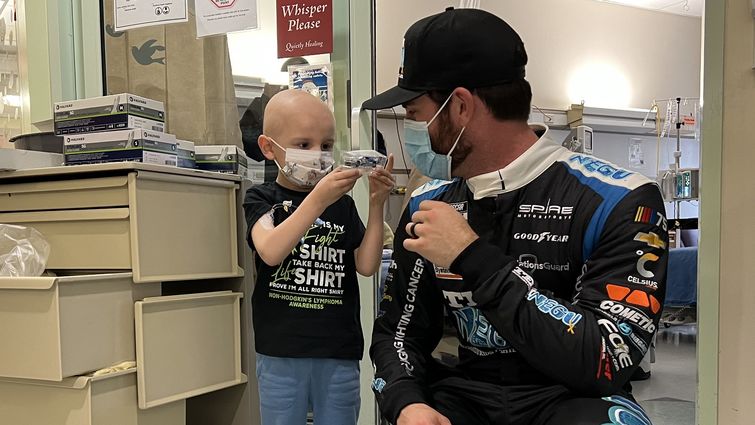NASCAR driver Corey Lajoie meets patient four-year-old Eligh Thompson at Loma Linda University Children’s Hospital.