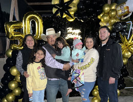Ramiro Brito Sanchez celebrates his 50th birthday surrounded by loved ones, including his wife, children, and grandchildren.
