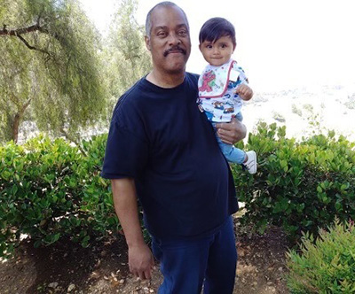 Larry Roberts with his grandson