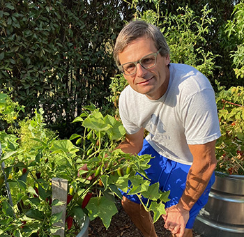 Dr. Hilliard with home-grown peppers 