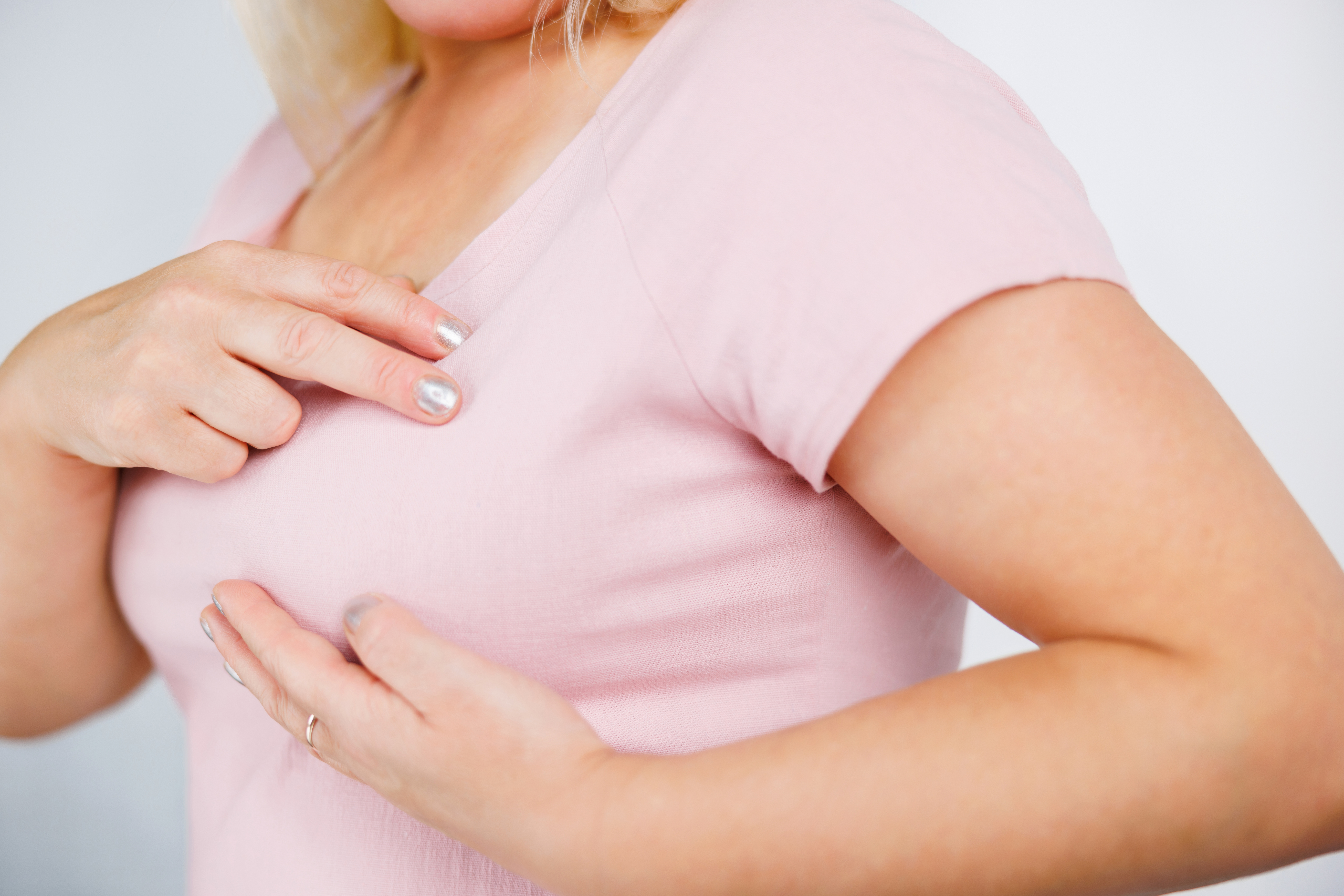 Woman conducting Breast self exam