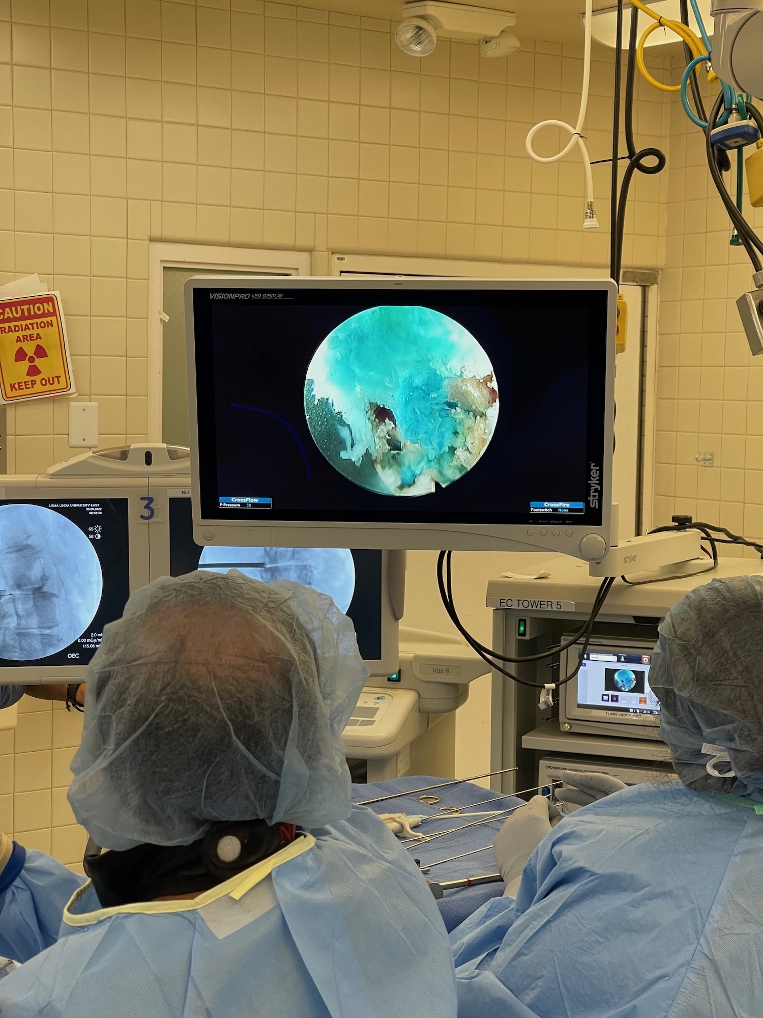 Doctors looking at a screen in the operating room