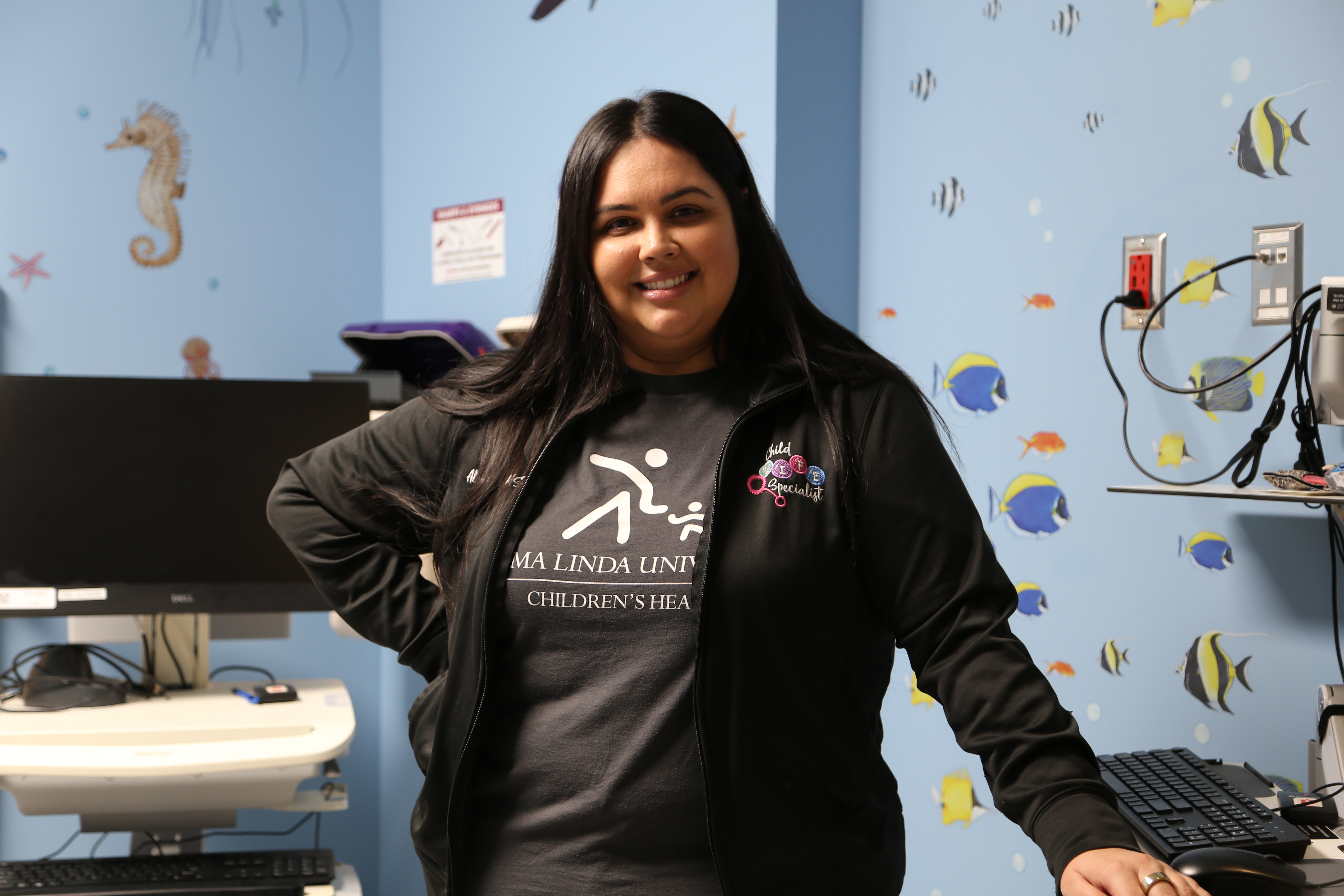 Child Life Specialist in treatment room