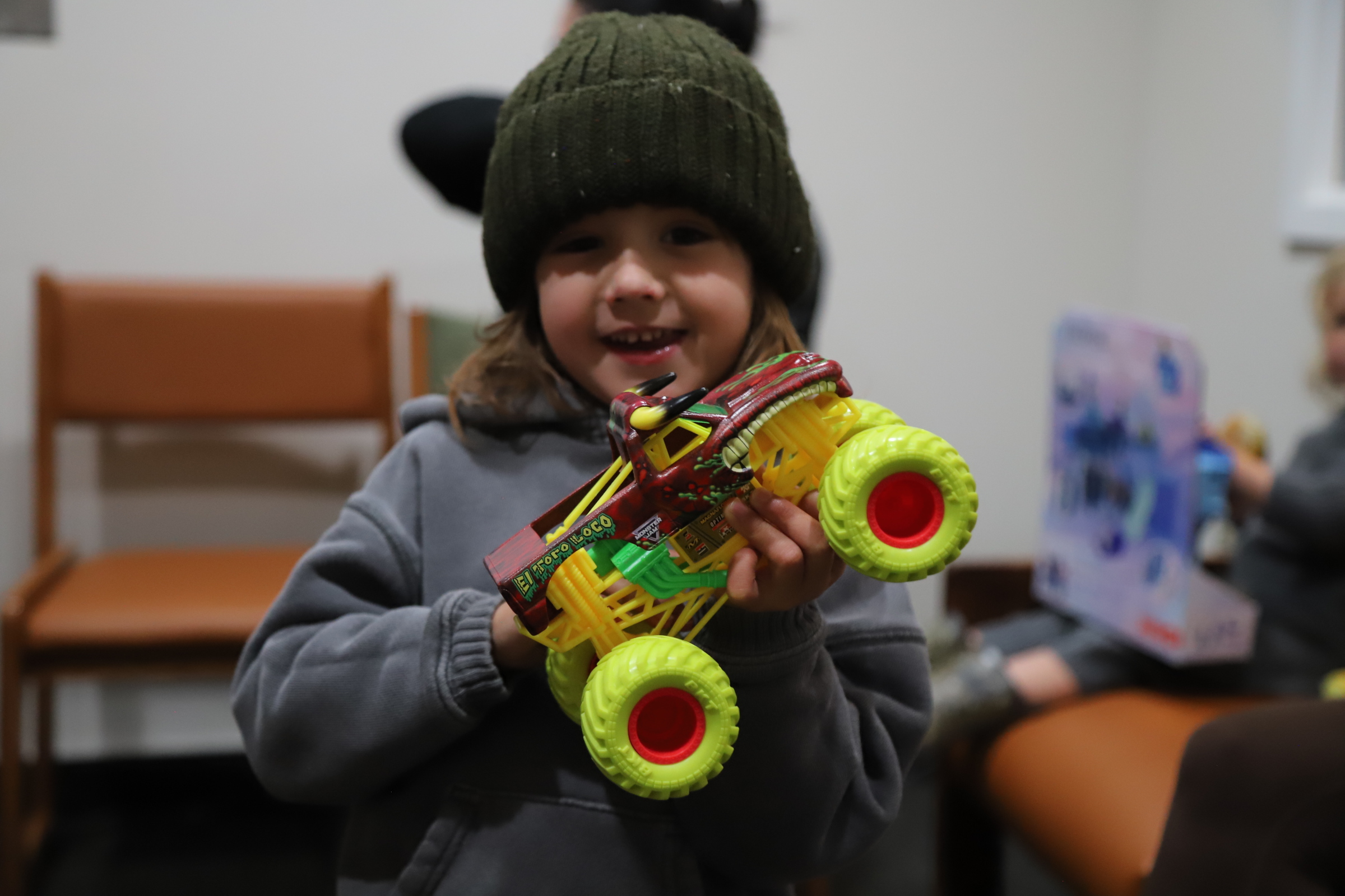 Stetson holding monster truck toy