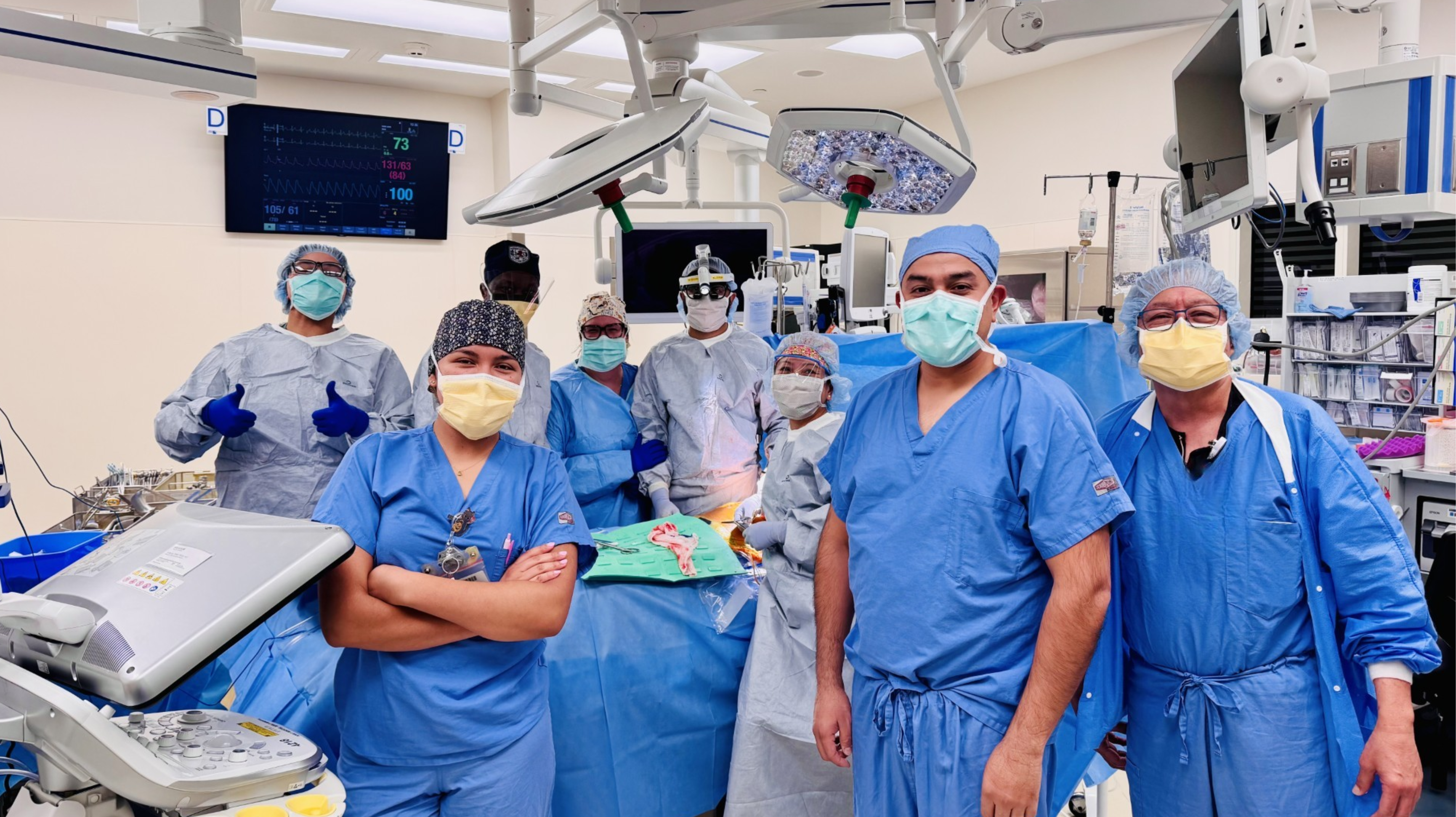 a group of medical staff in an operating room