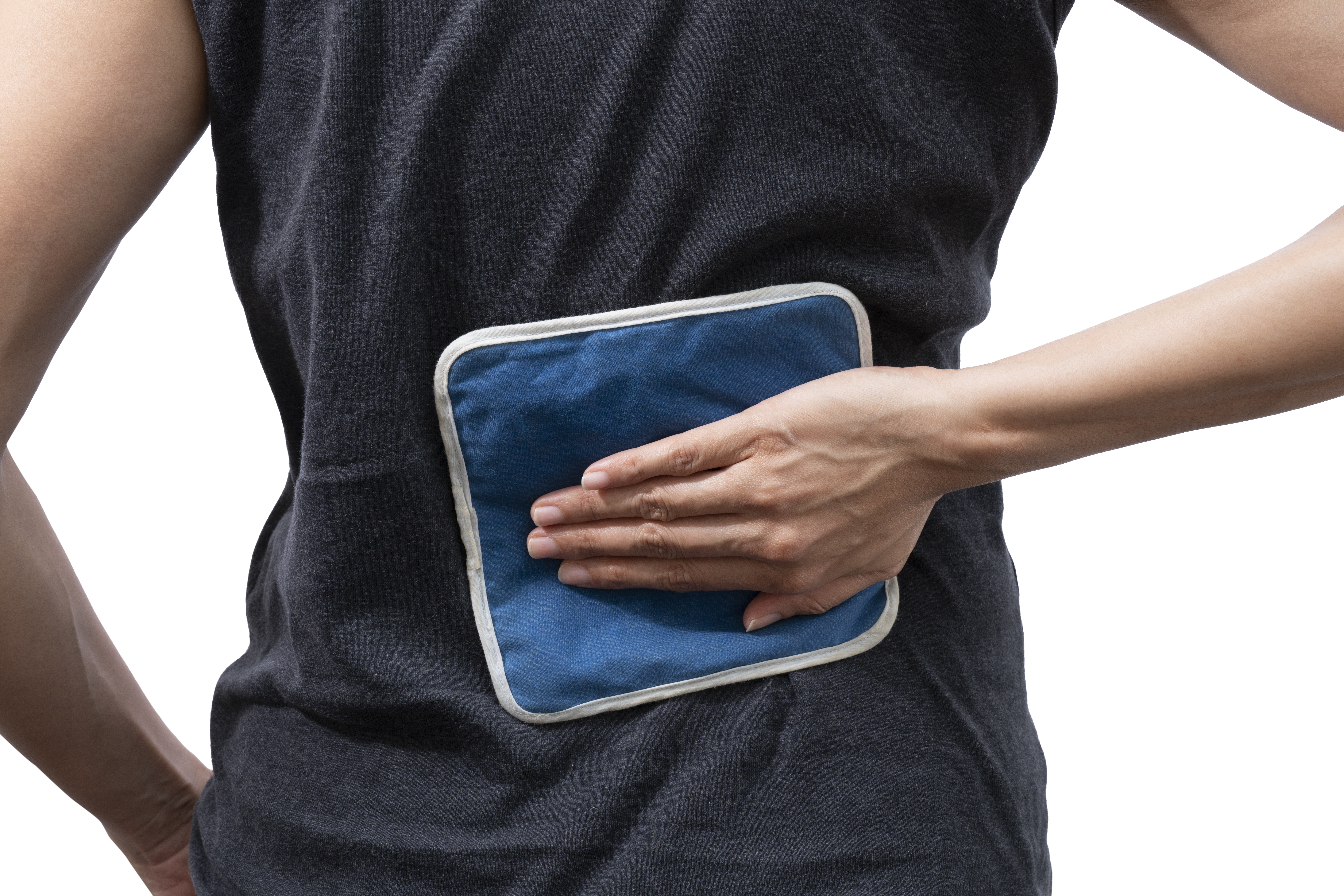  Woman putting an ice pack on her back pain on white background