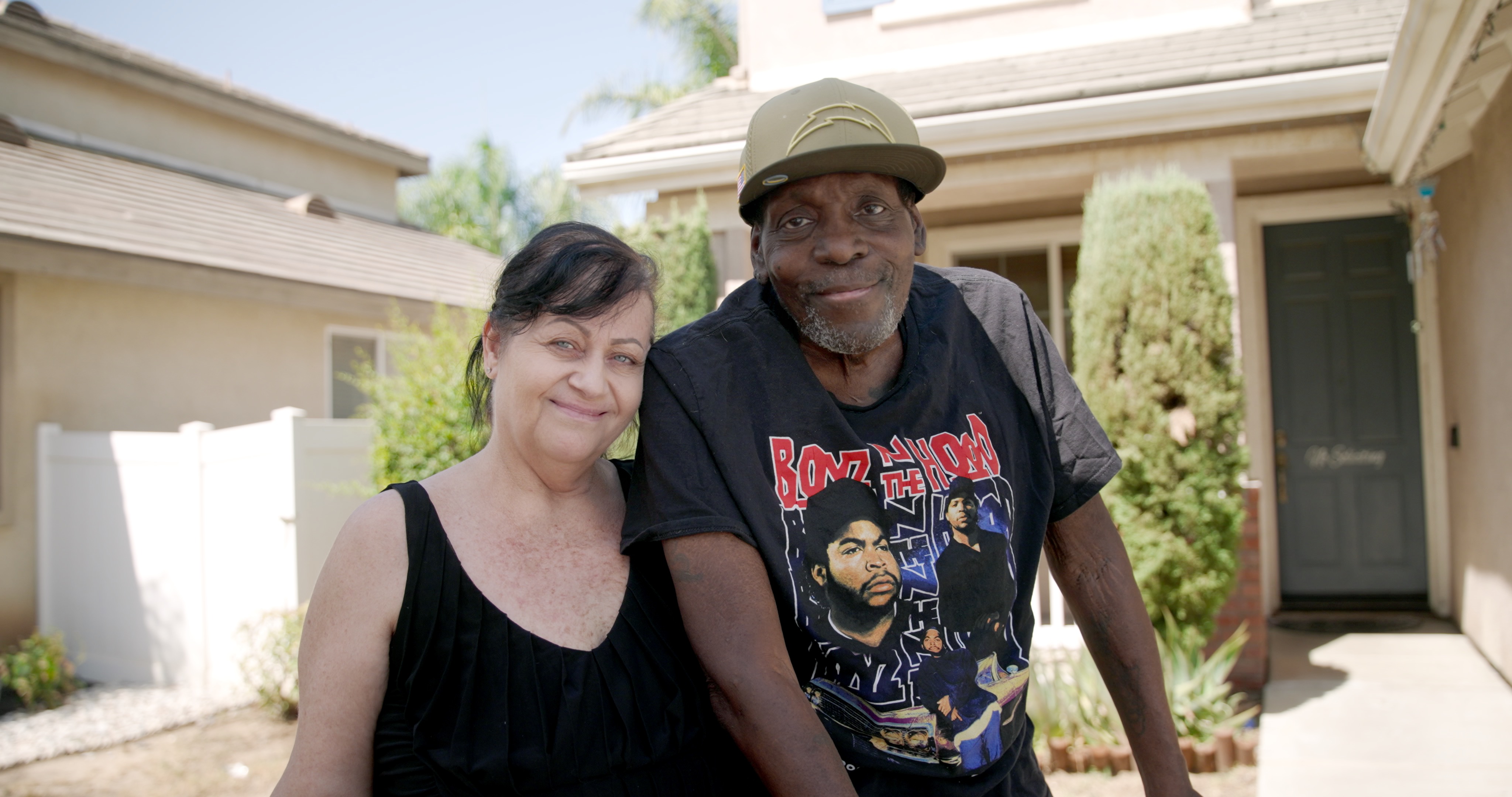 Edwin Smith standing outside with his wife