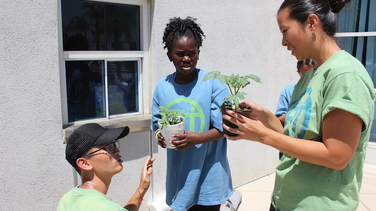 Angie Lam interacting with children from underserved communities during Operation Fit in 2015