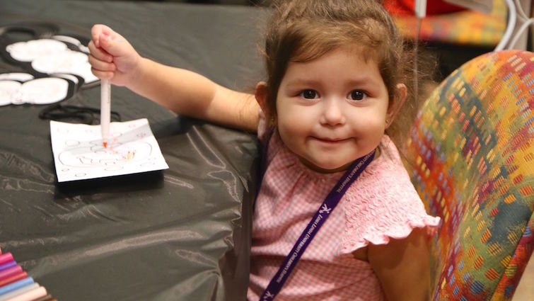 LLUCH patient, Natalie Rodriguez, 2, shows off her fun-filled smile at the annual Spirit of Children Fall Festival Thursday, Oct. 13.