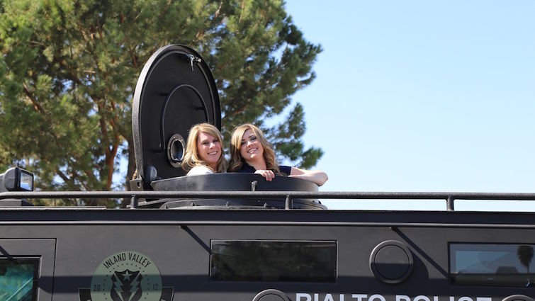 Former LLUCH patient, Megan Colley (right), and her mom, recently returned to the hospital for the 17th annual Cops for Kids Fly-In. Megan started the event with her family in an effort to benefit kids like her.