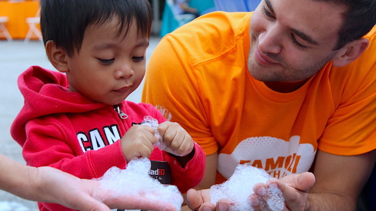 This year’s event offered a fully involved kid zone that included a sudsy foam pit. With the help of a volunteer, this young superhero got up close and personal with the moisture.