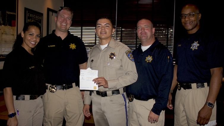 Officers from the Inland Division of California Highway Patrol paused for a photo at Tip a CHiP. From left, Sylvia Varga, Ryan Rebbe, Ramon Duran, Danny Symons and Lawrence Guynes.