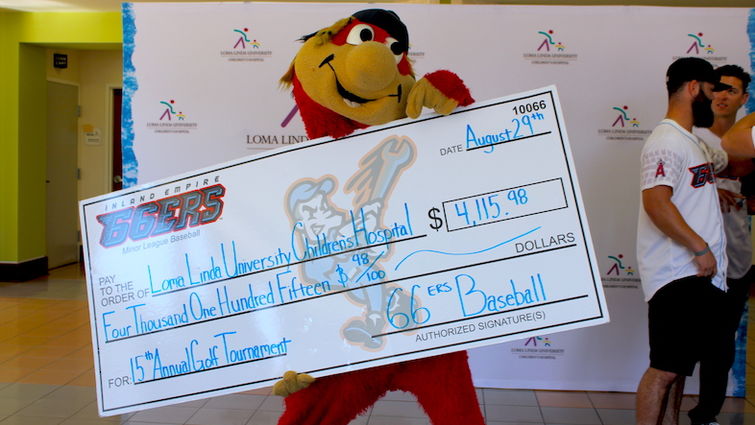 IE 66ers team mascot, Bernie, shows off the check he and members of the team presented to LLUCH on Tuesday, August 29.