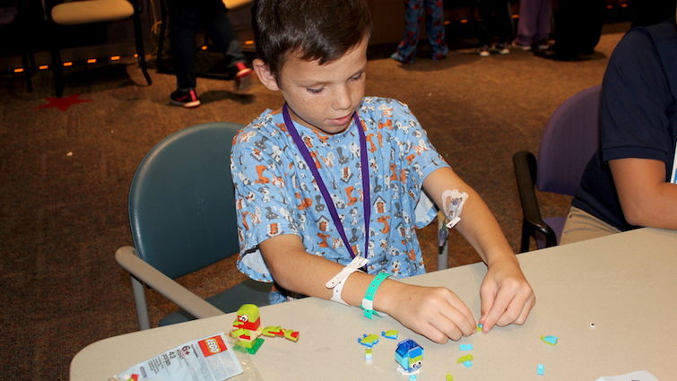 LLUCH patient, Riggs Lamberta, 8, was excited to build LEGO figurines at the Merlin’s Magic Wand event on Thursday, Sept. 28.