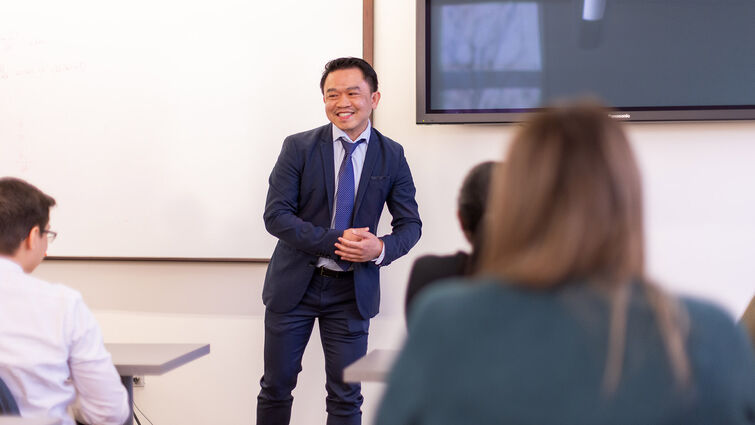 Dr De La Pena teaching in a Pharmacy classroom