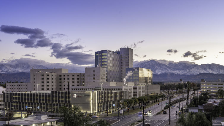 scenic photo of medical campus with mountains in background