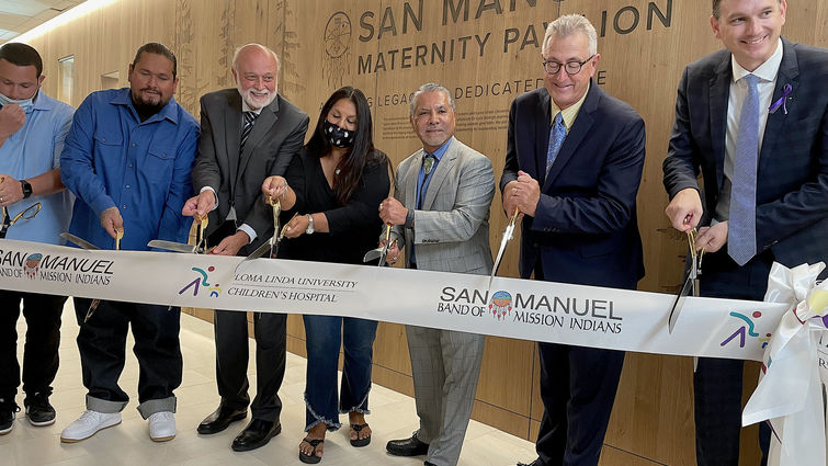 administrators and Tribe leaders cutting ceremony ribbon