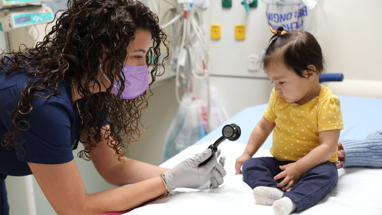 female doctor with toddler patient