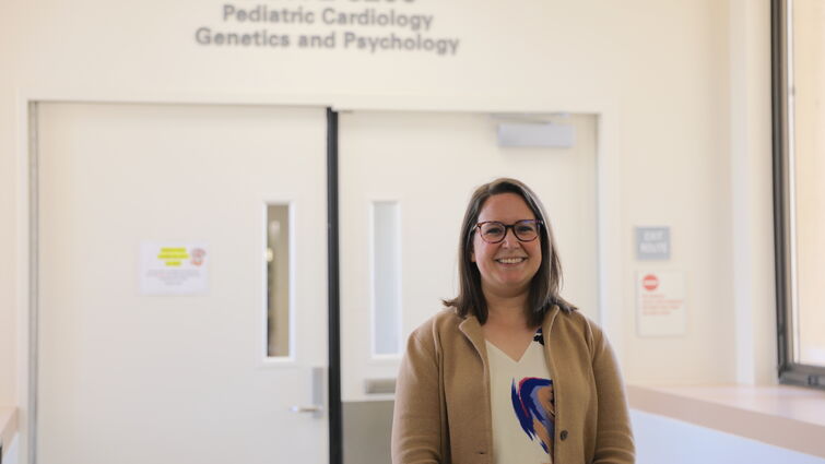 Amanda Suplee stands in front of pediatric psychology unit