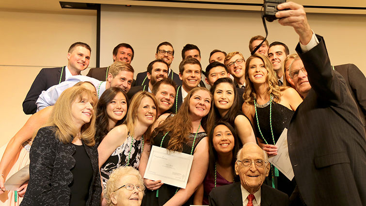 Roger Hadley, MD, dean of Loma Linda University School of Medicine, takes a selfie with the newest members of the Epsilon chapter of Alpha Omega Alpha moments after they were initiated into the honor medical society.