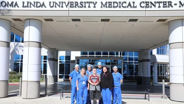 Dr. Parekh, Rickey Rodroguez, and the TARV team standing outside the Loma Linda Medical Center Murrieta