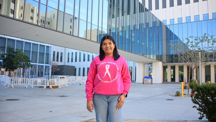 Ariatna standing outside hospital 