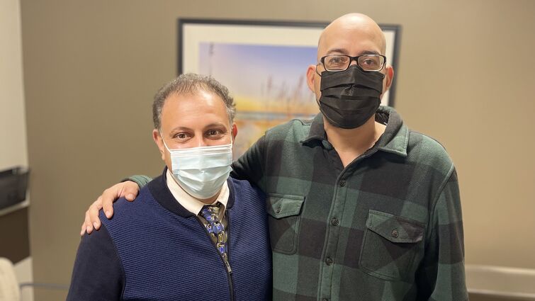 Aaron Alejos takes a photo with Dr. Dastjerdi
