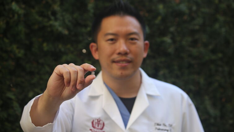 Dr. Ho holding the tiny BLVR valve