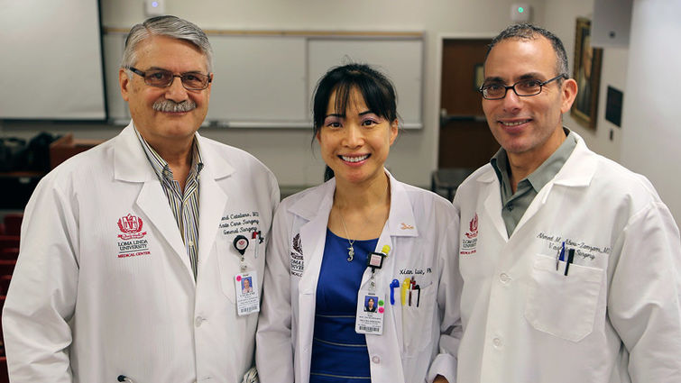 Left to right: Dr. Richard Catalano, Dr. Xian Luo, and Dr. Ahmed Abou-Zamzam smile