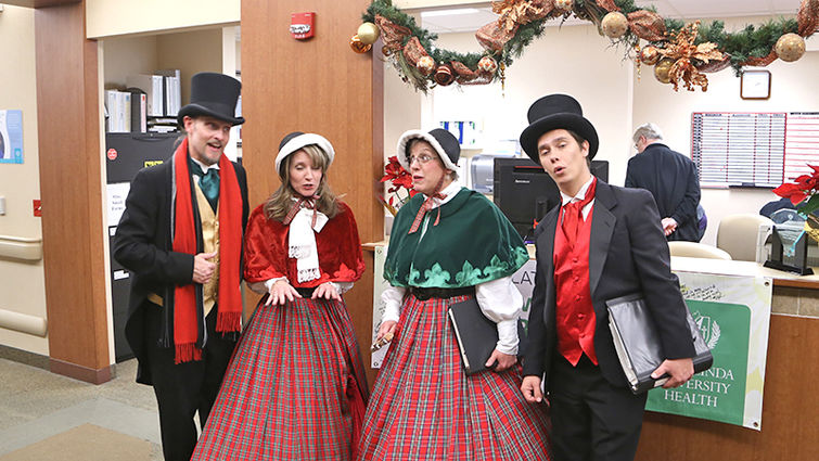 Performing “The Christmas Song” on Dec. 20 at Loma Linda University Surgical Hospital are members of the Desert Carolers, from left to right, John-David Wiese, Shannon Laux, Debora Biddick and Deryl Jon Blair. Desert Carolers John-David Wiese, Shannon Laux, Debora Biddick and Deryl Jon Blair performing “The Christmas Song” at Surgical Hospital Dec. 20.