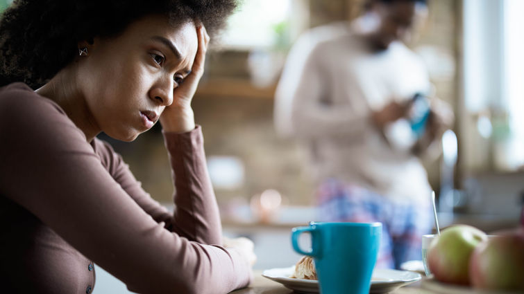 Displeased black woman having problems during morning in the kitchen. - stock photo