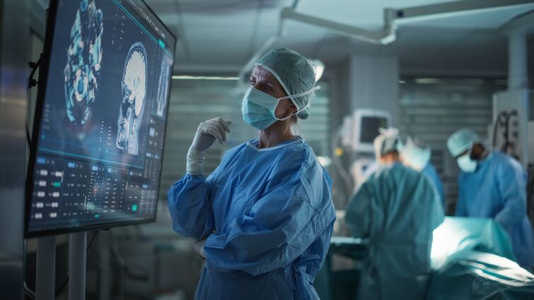 Professional Focused Caucasian Female Surgeon Reviewing Patient's Brain Scans