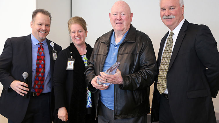 Don Bender (third from left) and Mark Hubbard (right) were honored for a combined total of 70 years of service to the safety coordinator program at Loma Linda University Health. Brett McPherson and Vicki Brown presented the awards.