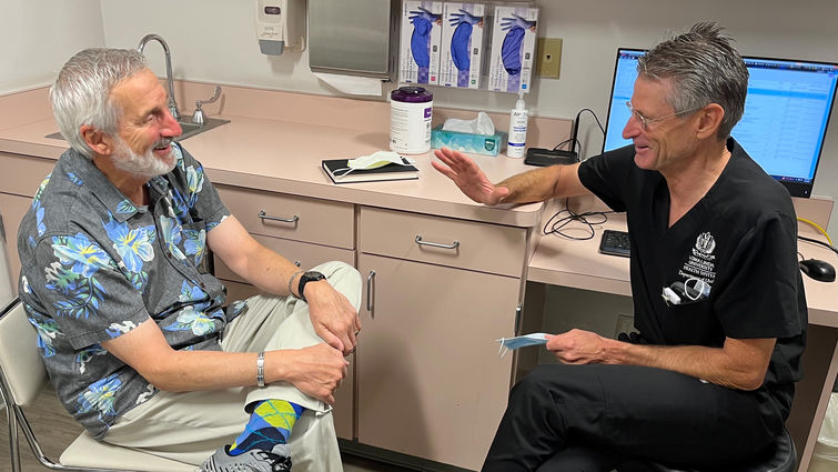 Urologist Herbert Ruckle, MD, ensures patients obtain access to factual information about prostate cancer. Dr. Ruckle consults with a patient in clinic