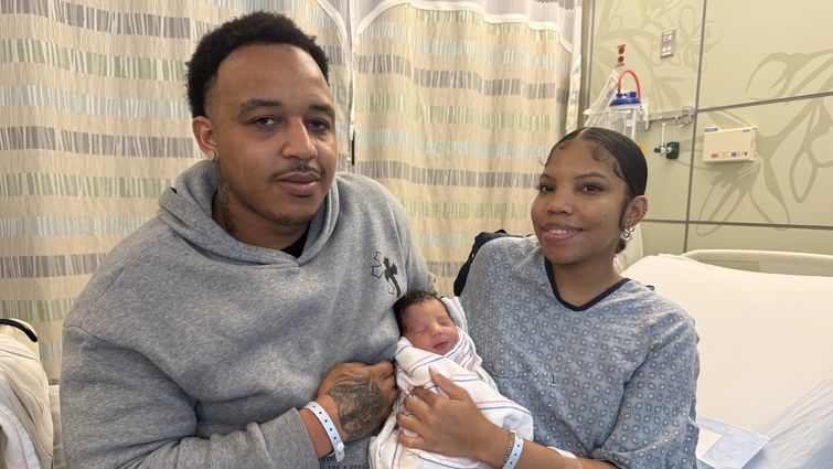 Parents Eric King and Alise Bailey hold their newborn, Carter King, who was born on New Year's Day at Loma Linda University Children's Hospital