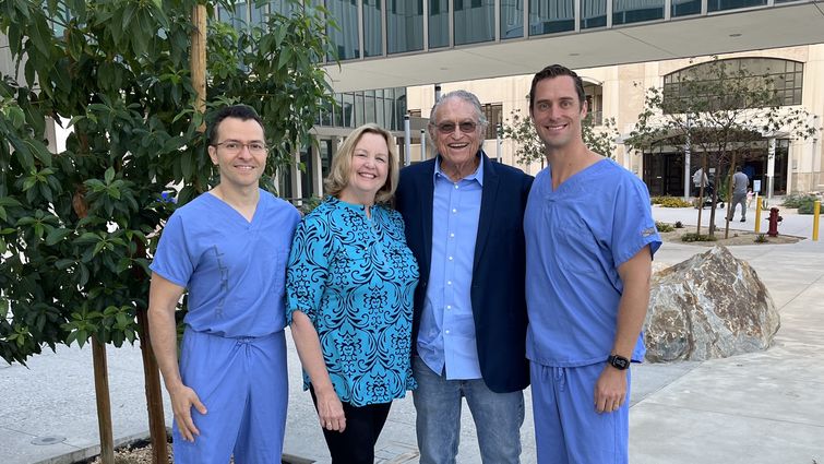 Amr Mohsen, MD (left), and Jason Hoff, MD (right), reunited with patient Donald Oaks and his wife (center) outside of Loma Linda University Medical Center. The cardiologists partnered with Oaks to perform several minimally invasive, life-restoring procedures. Doctors Amr Mohsen and Jason Hoff reunited with Mr. Donald Oaks and his wife outside of Loma Linda University Medical Center.