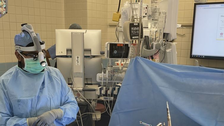 Neuromodulation is a one-hour outpatient procedure Dr. Hussain in the operating room about to perform a neuromodulation surgery