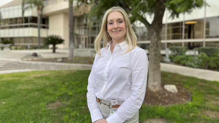 Dr. Heather Figueroa in front of Coleman Pavilion