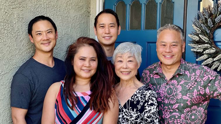 Jean Hwang smiles, surrounded by her four children.