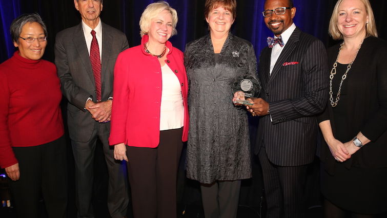 Loma Linda administrators Marie Hodgkins and Lyndon Edwards hold the Top Teaching Hospital Award after receiving it Dec. 6 in Washington, DC. They are pictured with individuals including Leapfrog’s Leah Binder (center, in red) & Laurel Pickering (right).