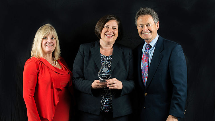 Barbara Couden Hernandez, PhD, center, receives the Medicus Integra Award. With her are Dianne McCallister, MD, left, CMO at Medical Center of Aurora, Colorado, and Ted Hamilton, MD, vice president of medical mission, Adventist Health System.