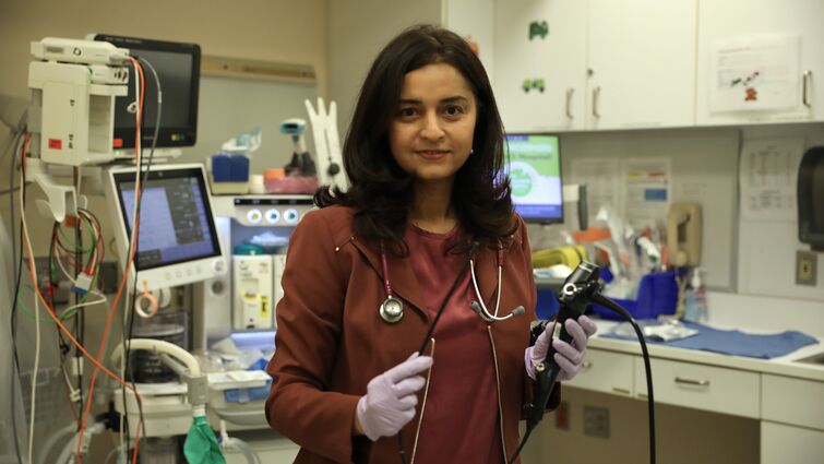 Dr. Khyati Mehta holds transnasal endoscopy scope in GI lab at Loma Linda University Children's Hospital Dr. Mehta in Gi lab with transasal endoscopy scope