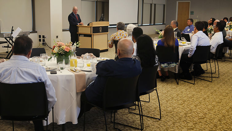 Ravvi Hillel Cohn addresses colleagues during an event honoring their work. He spoke on “Connecting Faith and Health.”