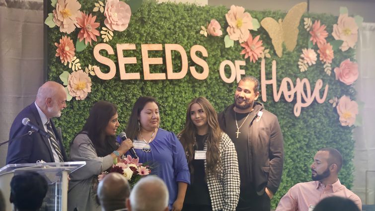 Dr. Richard Hart presents the Behavioral Health Champion Award to Alaina Mathews for her and her family's support of Loma Linda University Behavioral Health. Seeds of Hope