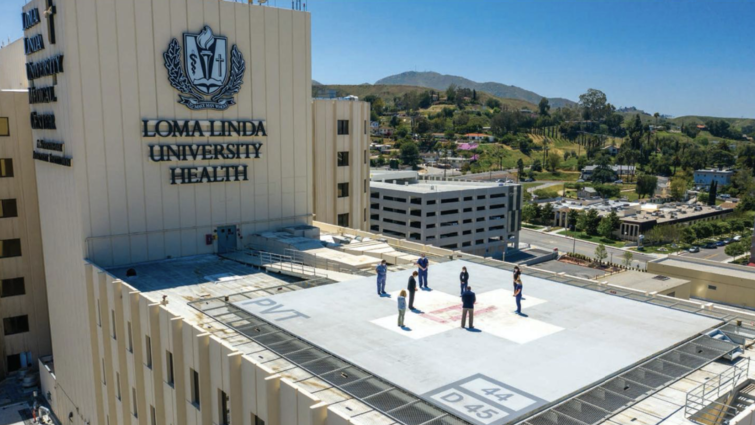 Staff pray on the north Medical Center helipad at the height of the pandemic. Helipad prayer