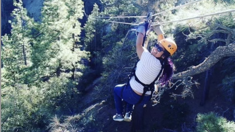 Wendy Bazail smiling before riding down a zipline