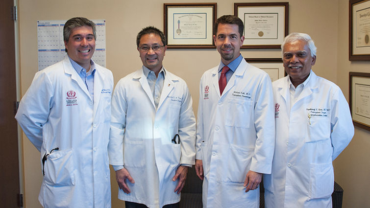 From left to right, Drs. Rafael Villicana, Michael de Vera, Michael Volk and Arputharaj Kore are some of the members of the transplant team who helped make the remarkable five days a success for the patients. doctors take a photo