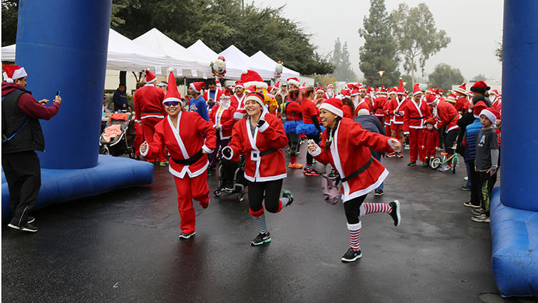 Runners dressed as Santa warmed up at the start line.