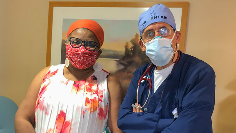 Shilene Blain-Hearns (left) partnered with Mojtaba Akhtari, MD (right), for treatment of her rare blood cancer. From left: Shilene Blain-Hearns and Mojtaba Akhtari, MD