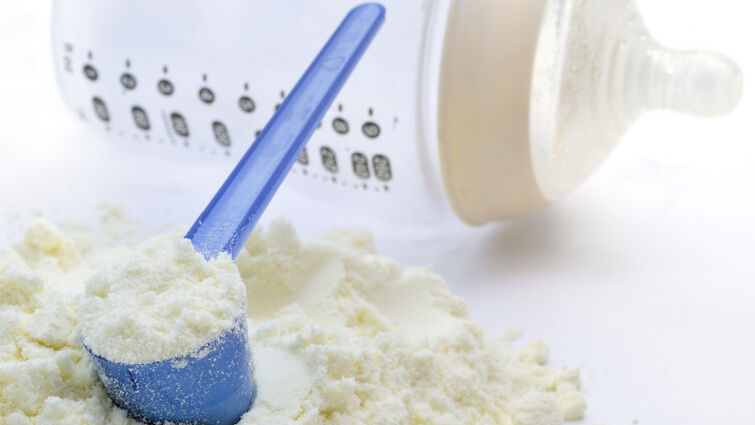powdered baby formula and a bottle